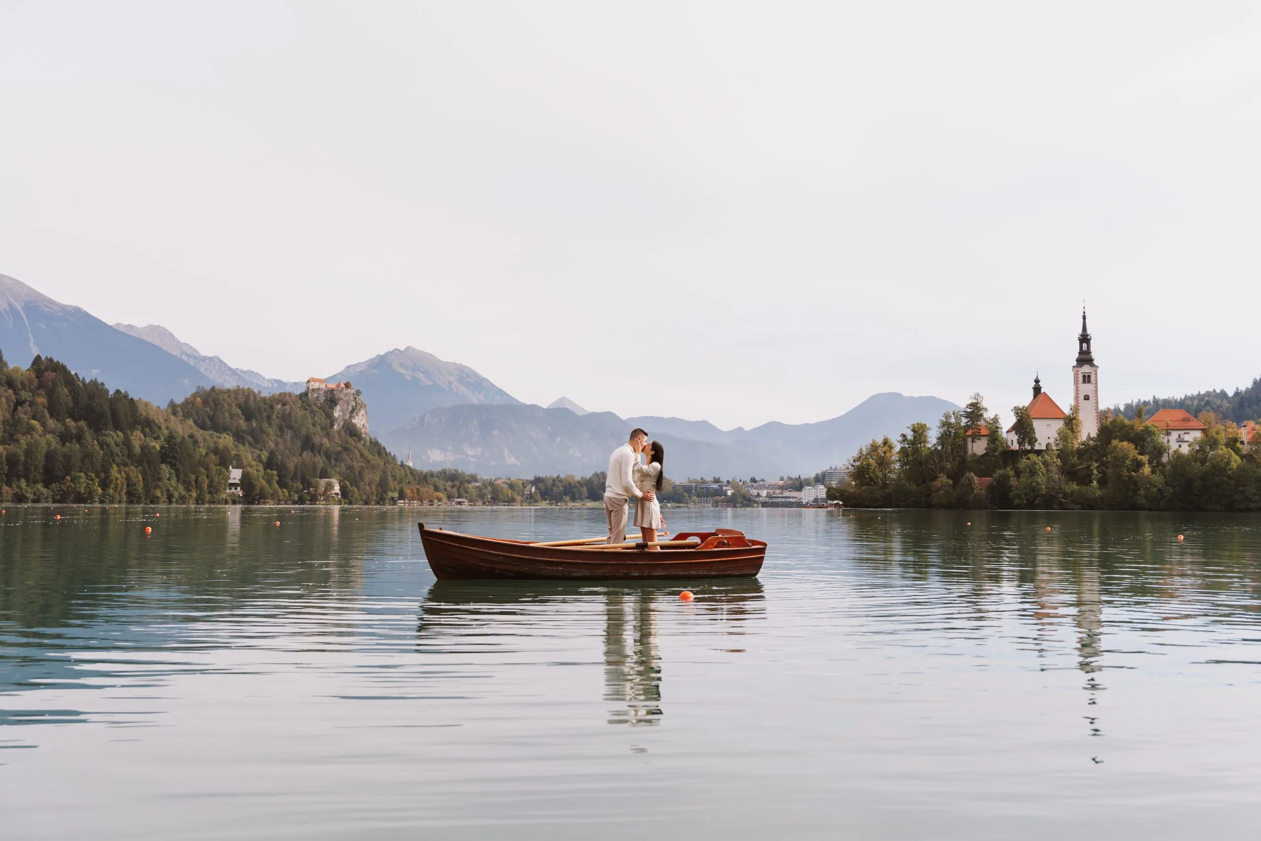 Romantic rowing boat proposal photography at Lake Bled in Slovenia