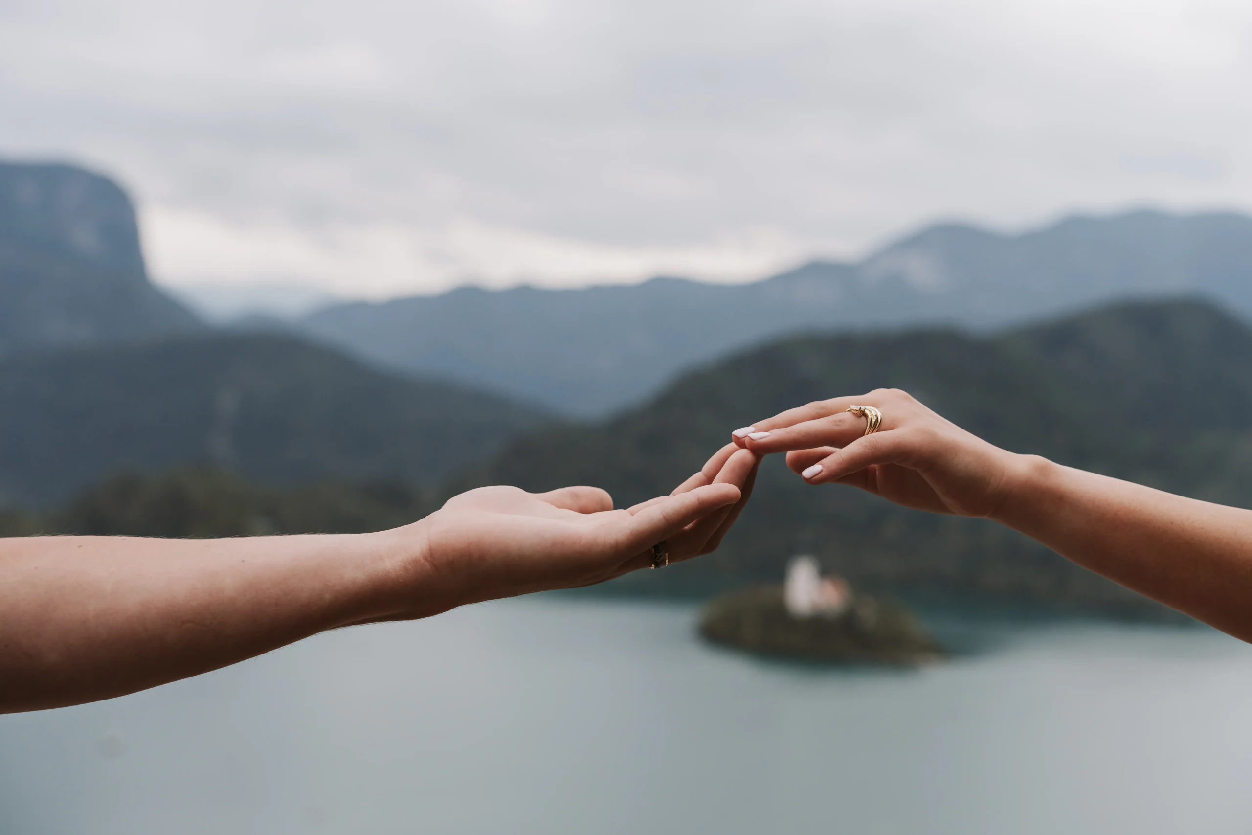 Bride and groom portraits at Lake Bled with romantic scenery