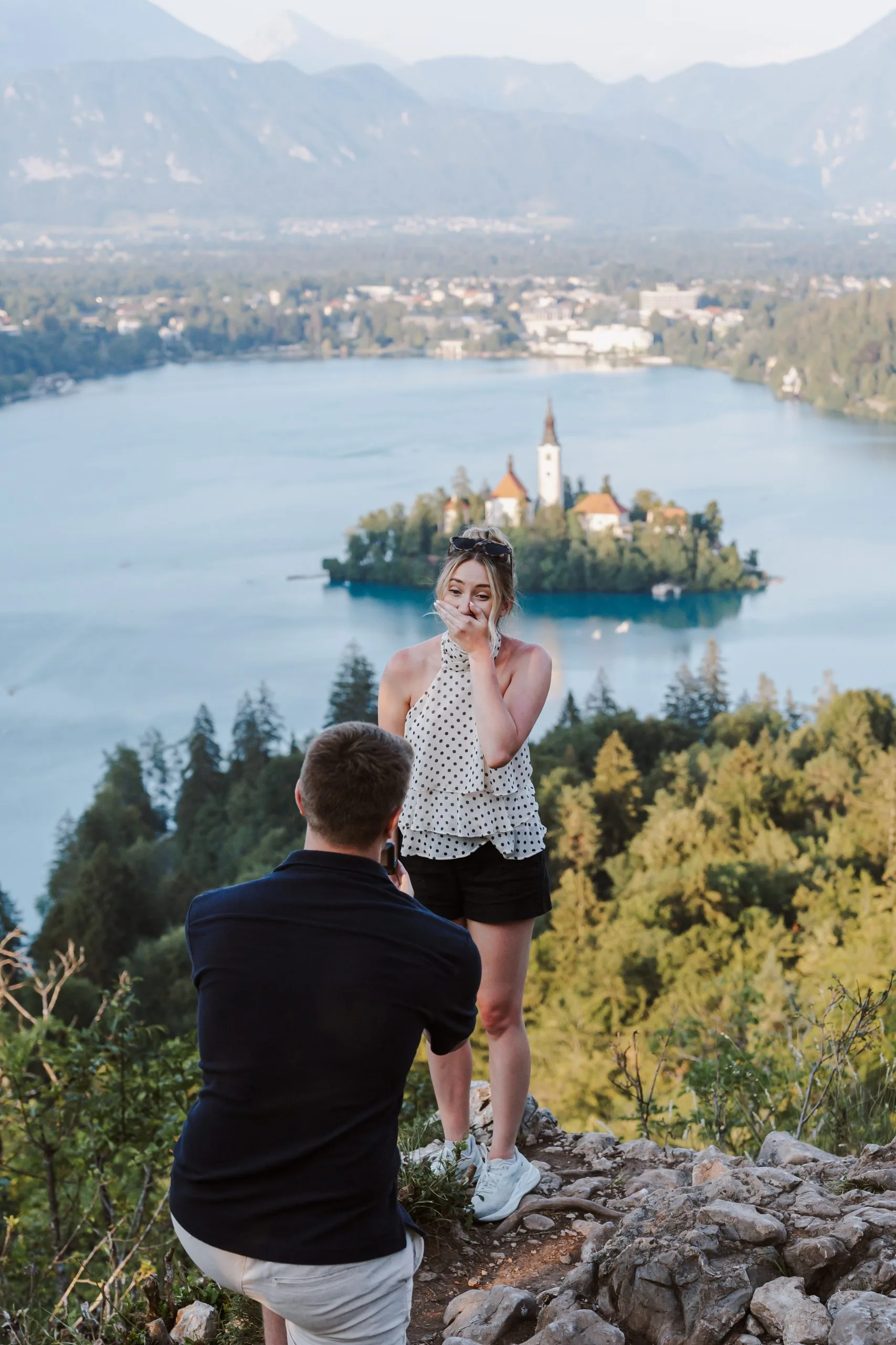 Lake Bled proposal photographer discreetly capturing a surprise proposal in Slovenia