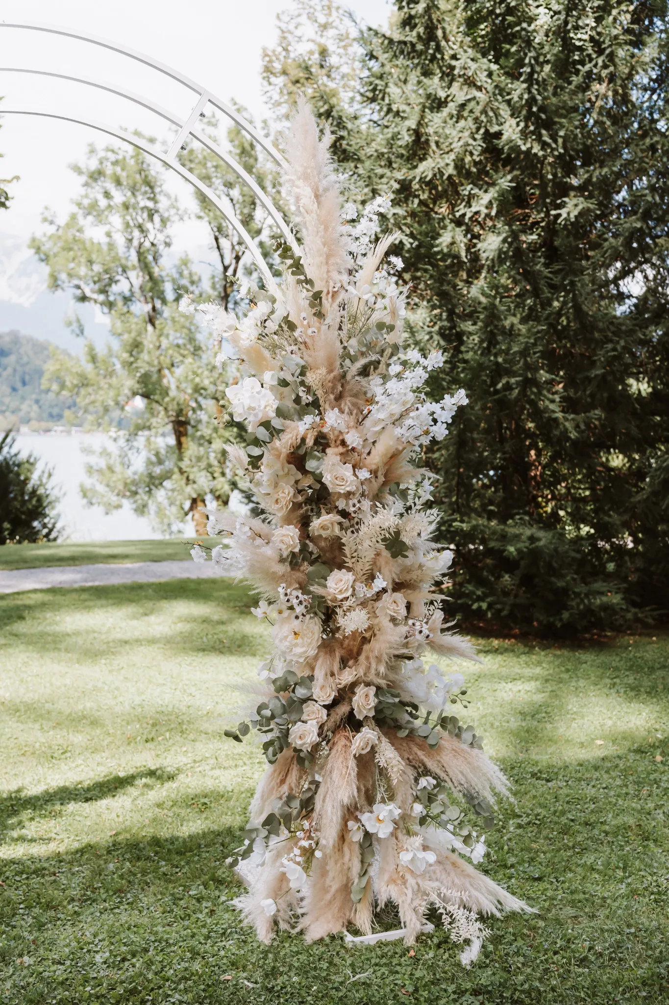 Floral wedding arch overlooking Lake Bled