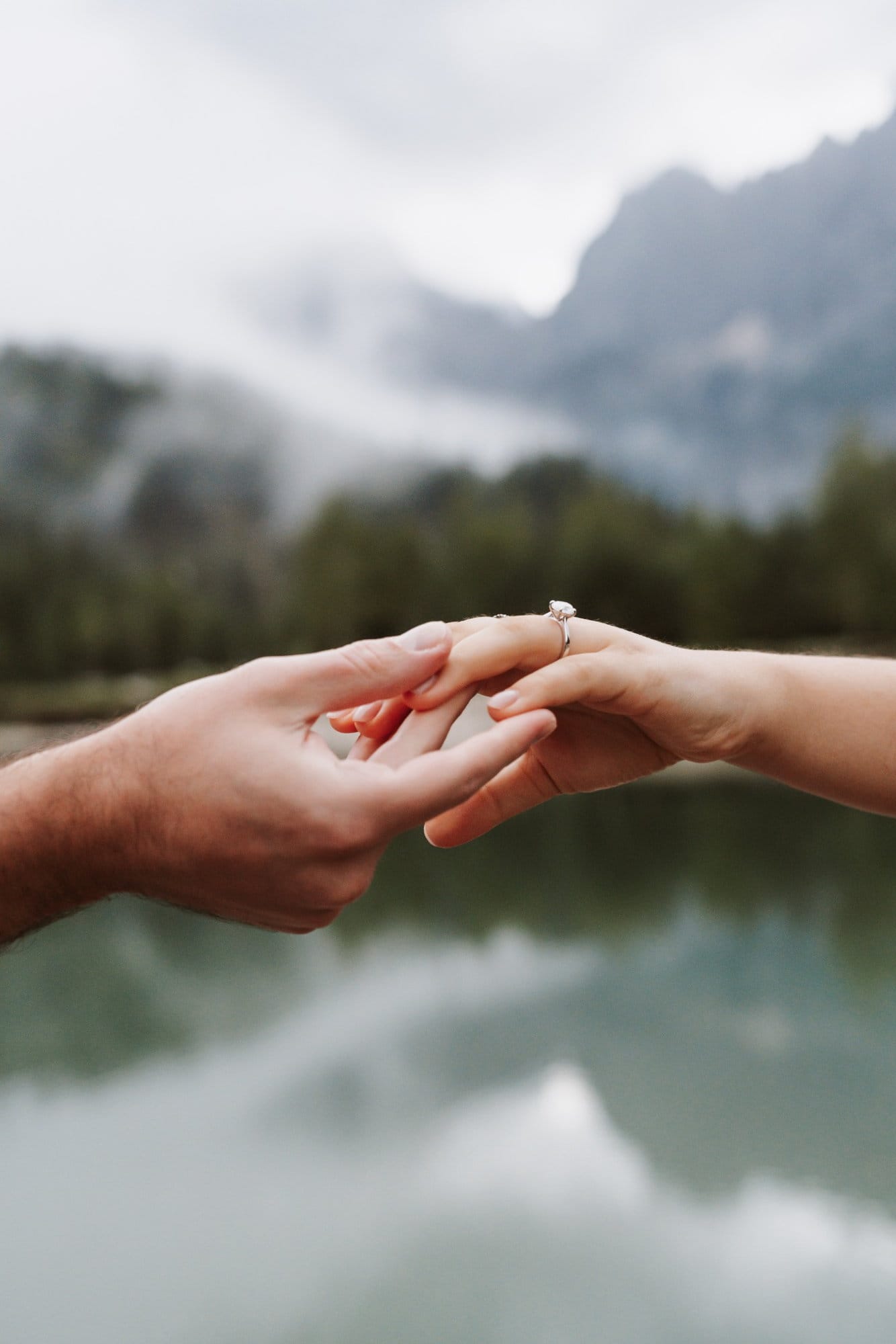 Engagement ring detail after a Lake Jasna proposal with misty mountains in the background